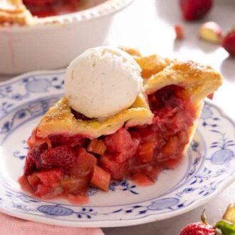 A slice of strawberry rhubarb pie with ice cream on top.