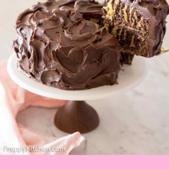 Pinterest graphic of a slice of zebra cake being lifted from the cake.