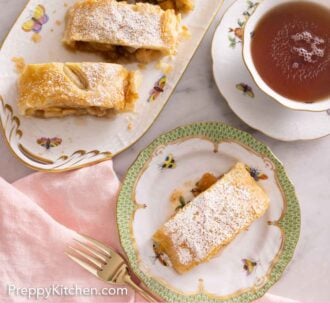 Pinterest graphic of the overhead view of cut apple strudel with a plate with one slice on it.