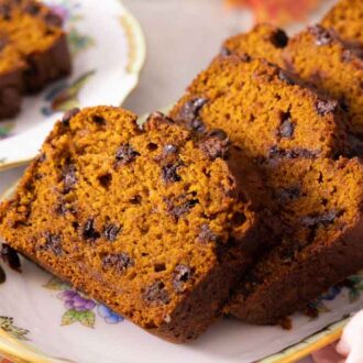 A platter of sliced chocolate chip pumpkin bread.