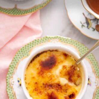 Pinterest graphic of an overhead view of a ramekin of crème brûlée with a spoon inserted.