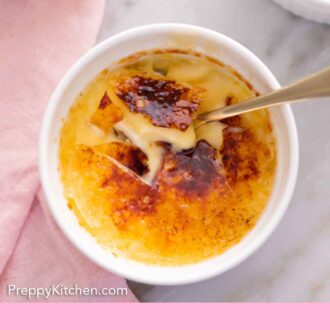 Pinterest graphic of an overhead view of a spoon inserted into a ramekin of crème brûlée.