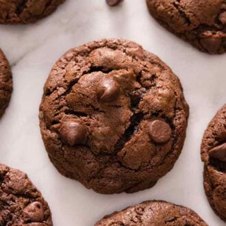 Overhead view of multiple cookies with one double chocolate chip cookie in the middle.