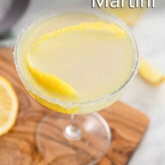 Pinterest graphic of a glass of lemon drop martini with a sugared rim and lemon twist garnish.