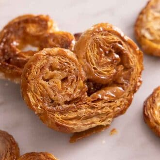 A palmier propped on top of another.