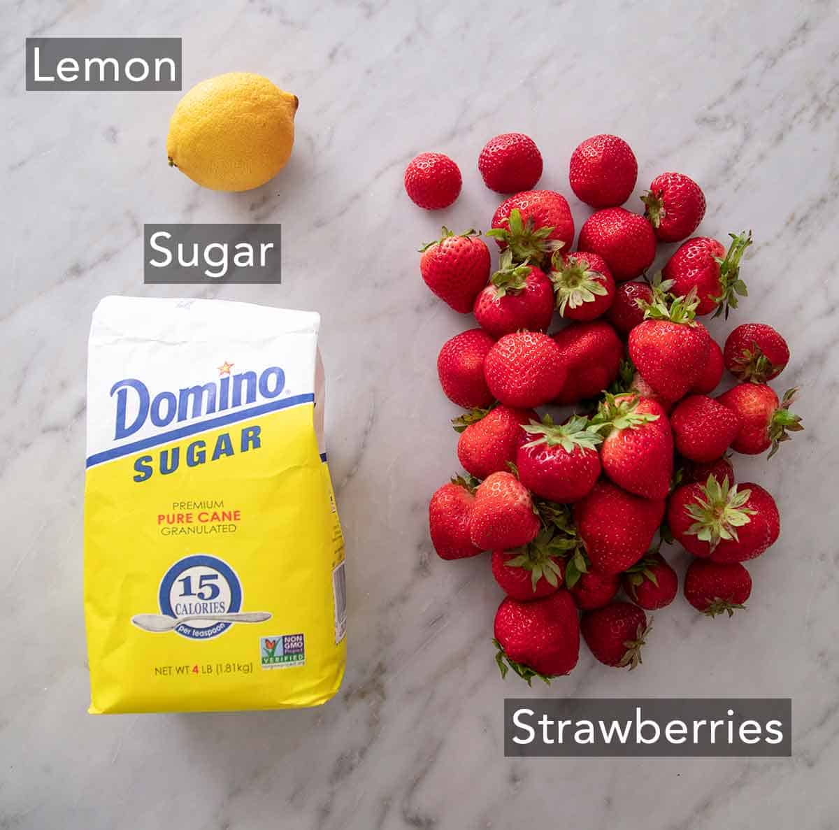 Ingredients needed to make strawberry jam.