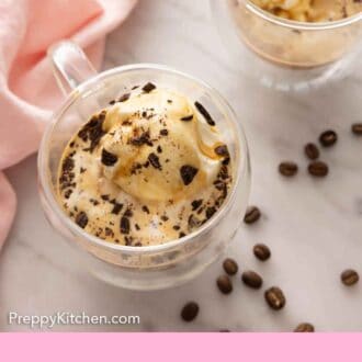 Pinterest graphic of the overhead view of two glasses of affogato with coffee beans strewn around.