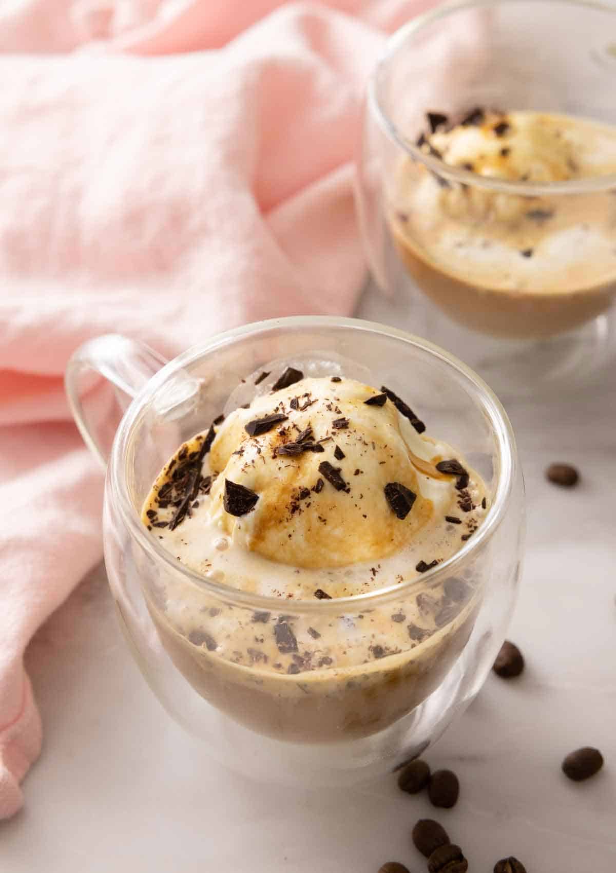 Two glasses of affogato with one in front of the other.