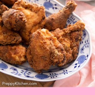 Pinterest graphic of a platter fried chicken beside a pink linen napkin.
