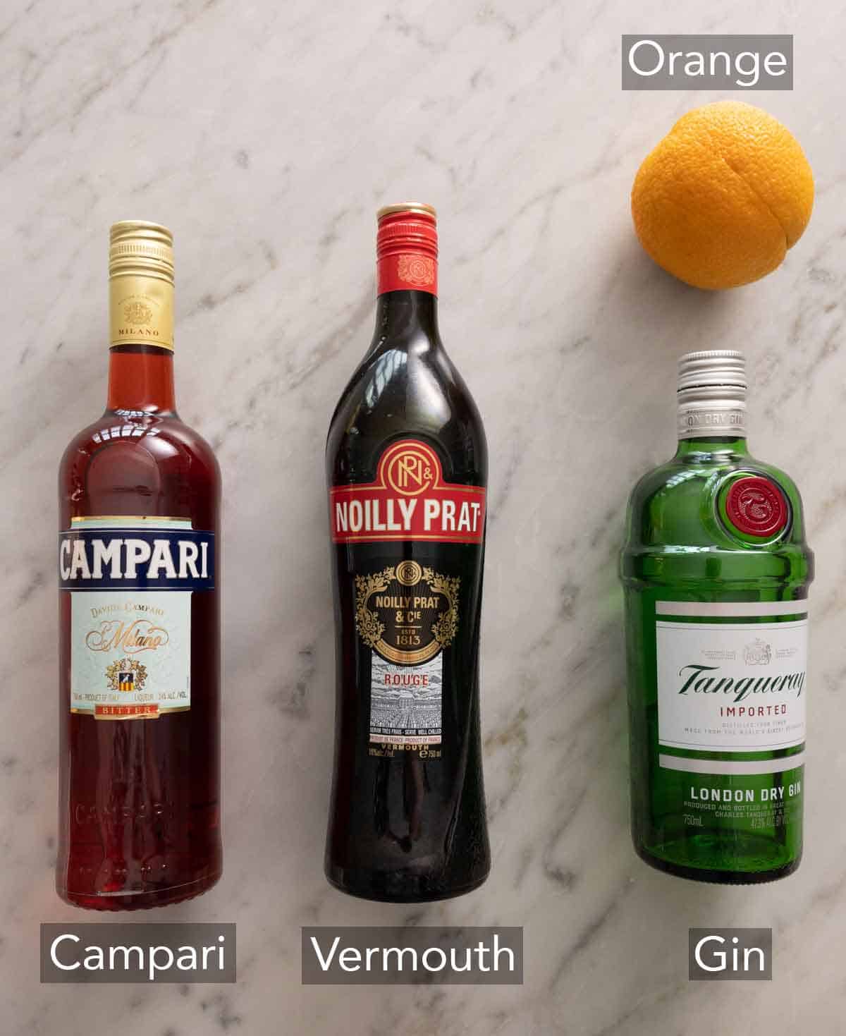Ingredients needed to make a Negroni.
