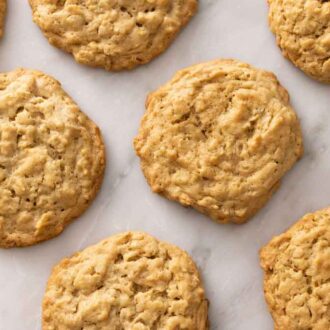 Overhead view of multiple peanut butter oatmeal cookies in a single layer.