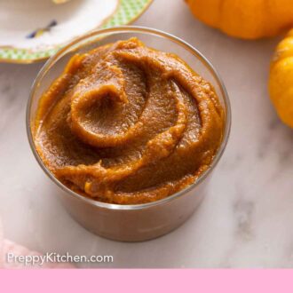 Pinterest graphic of a glass jar of pumpkin butter.