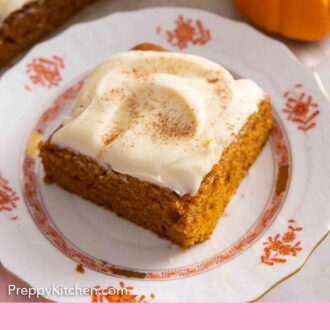 Pinterest graphic of a plate with a square slice of pumpkin cake with cream cheese frosting on top.