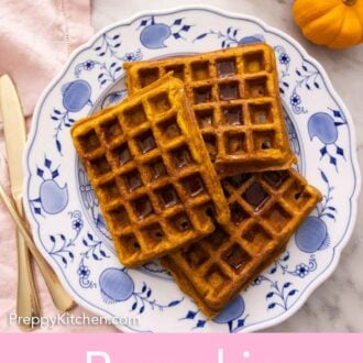 Pinterest graphic of three pumpkin waffles on a plate with syrup on top.