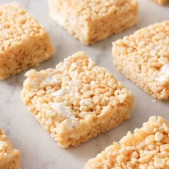 Multiple rice crispy treats laid out in a grid.