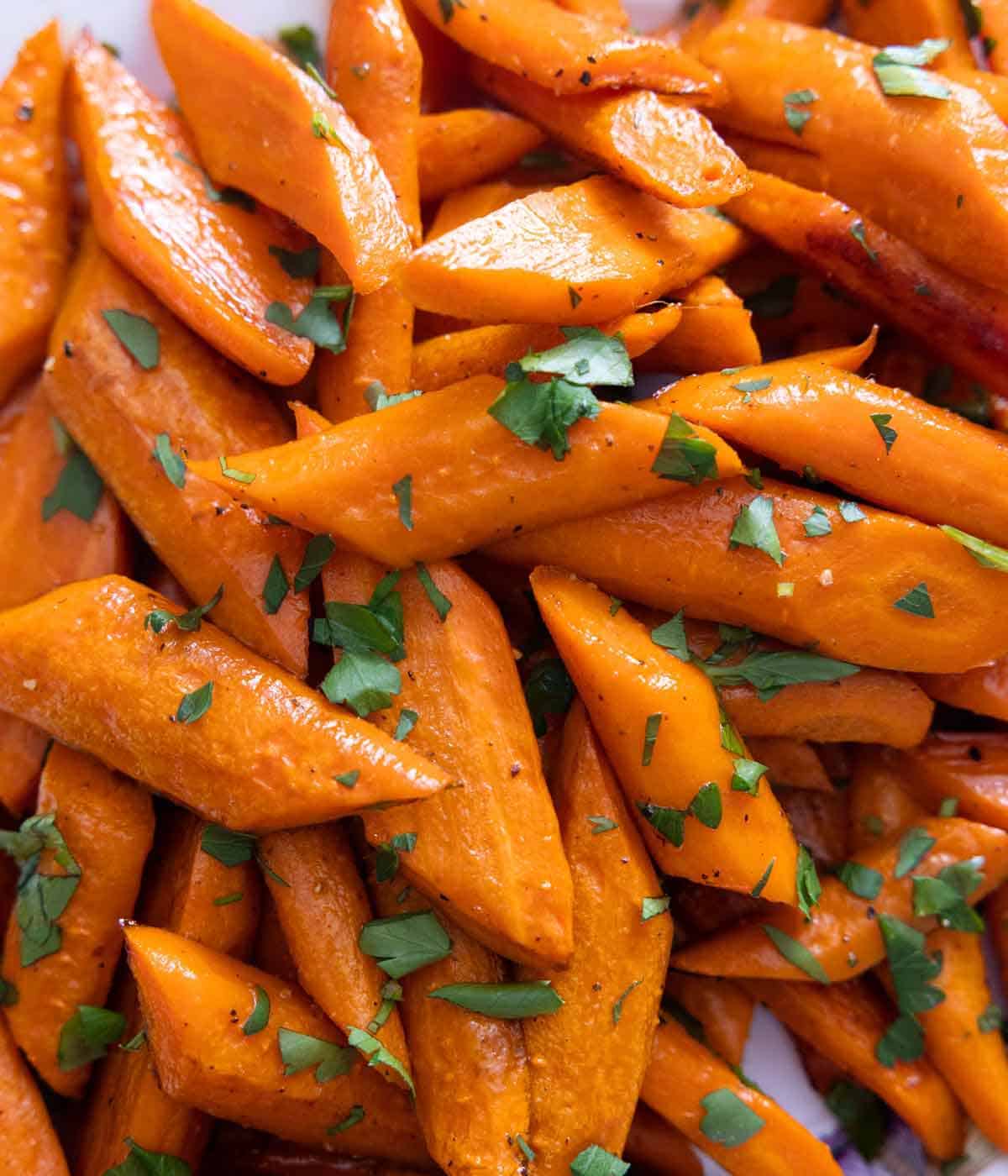 Close up of diagonally cut carrots, roasted.