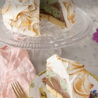 Pinterest graphic of a baked Alaska with a slice cut and served in front.