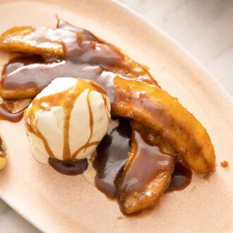 An oval plate with a serving of Banana Foster.