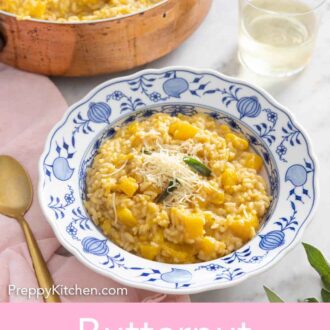 Pinterest graphic of a bowl of butternut squash risotto by a glass of wine and a pot of risotto.