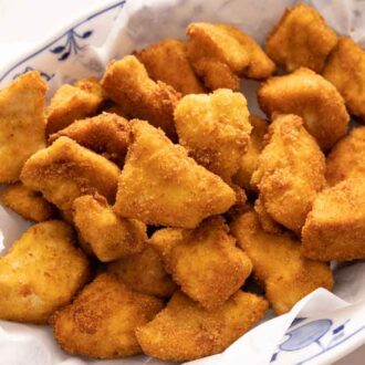 An oval plate of chicken nuggets.