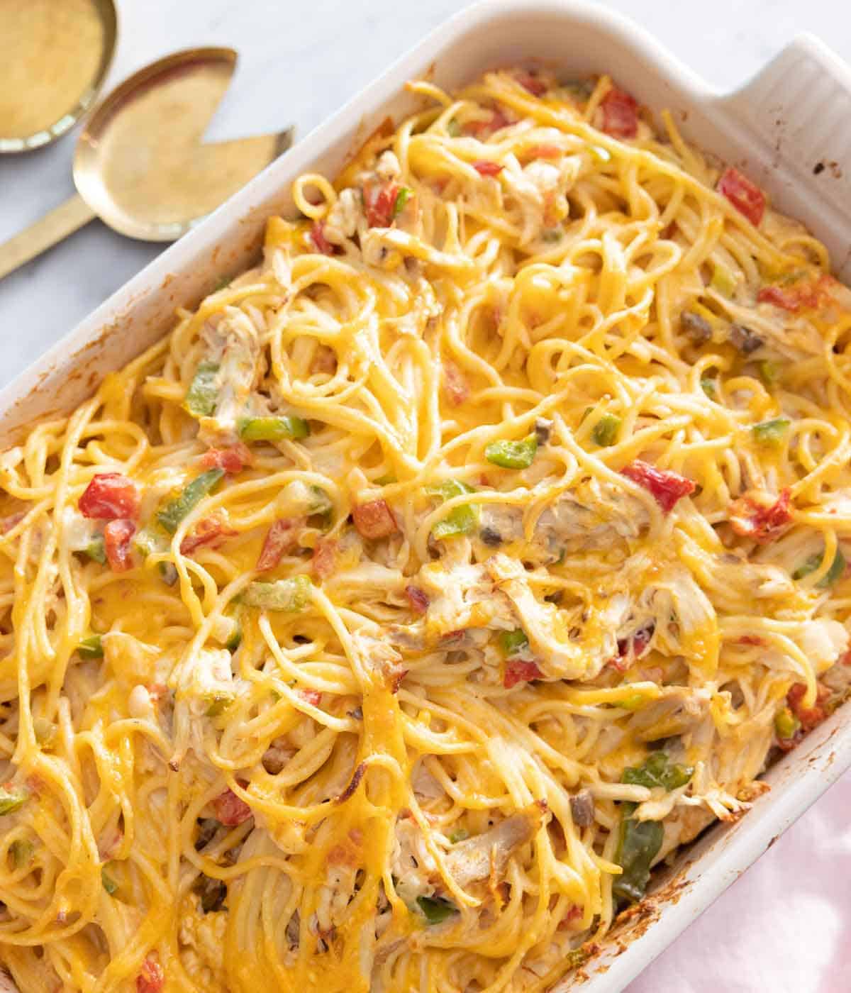 A casserole dish of baked chicken spaghetti.