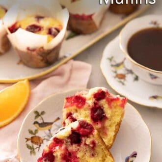 Pinterest graphic of a plate with a cranberry orange muffin sliced in half.
