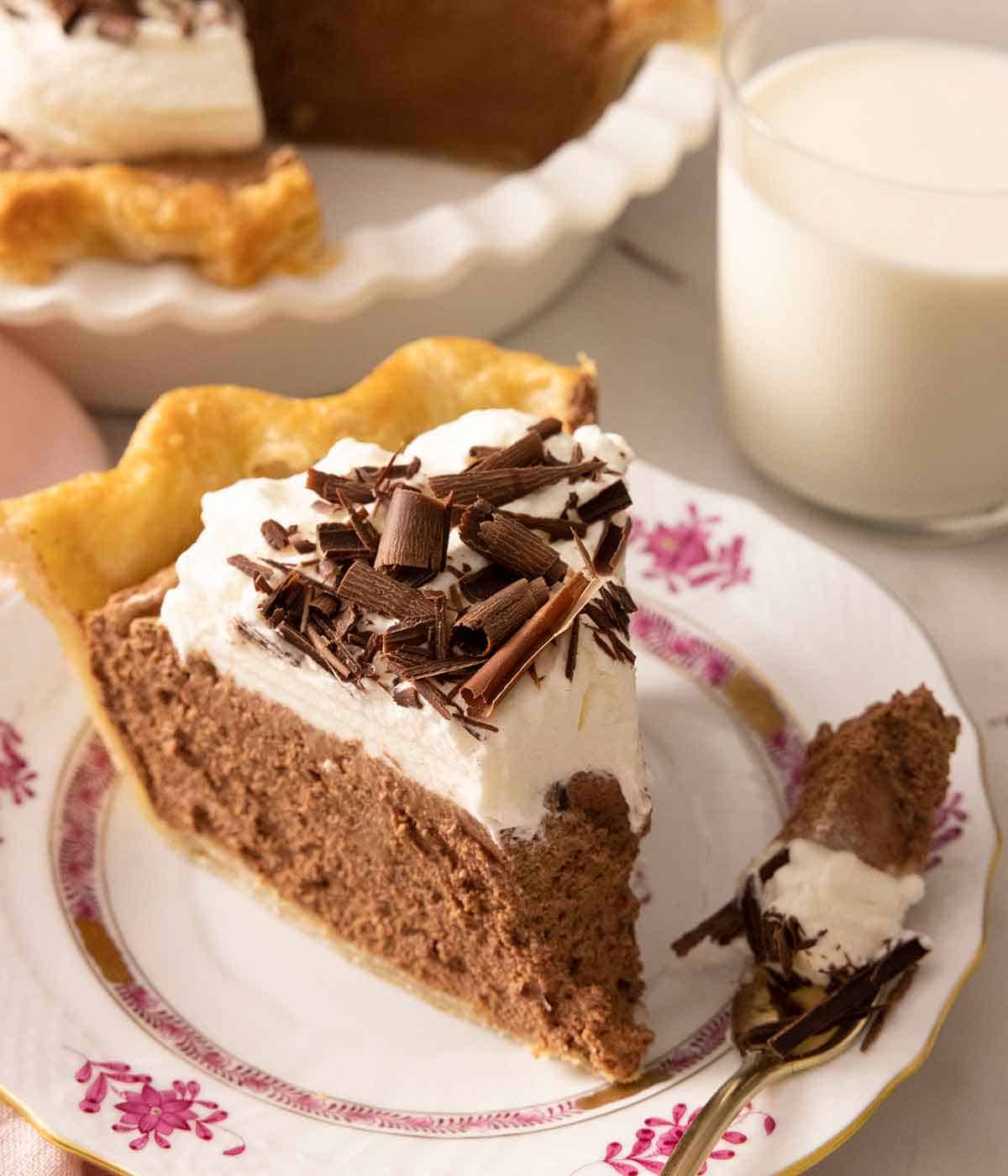 A piece of French silk pie with a piece on a fork.