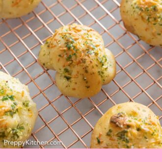 Pinterest graphic of garlic knots on a wired rack.