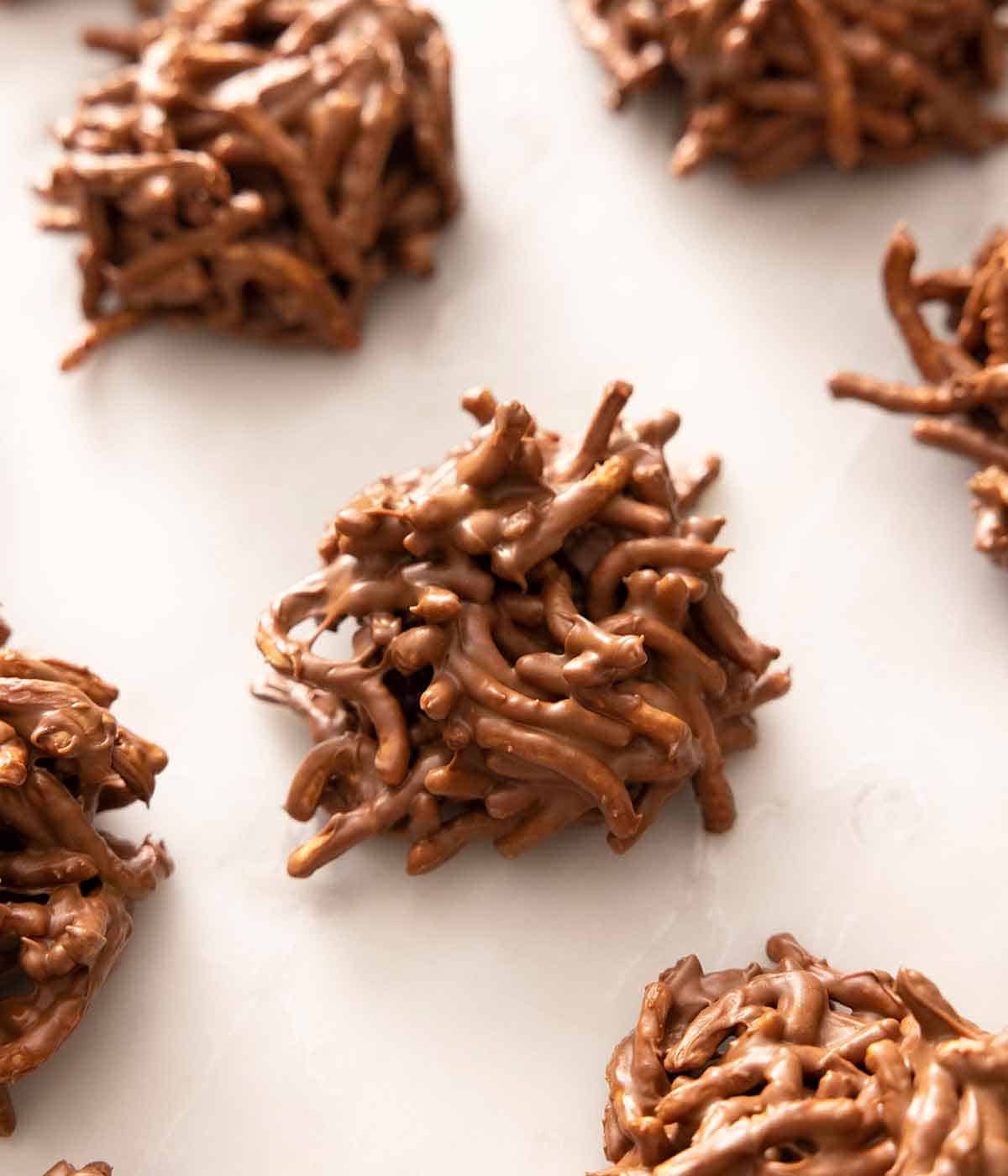 Multiple haystack cookies in a single layer on a white surface.