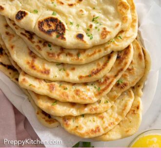 Pinterest graphic of a stack of naan bread.
