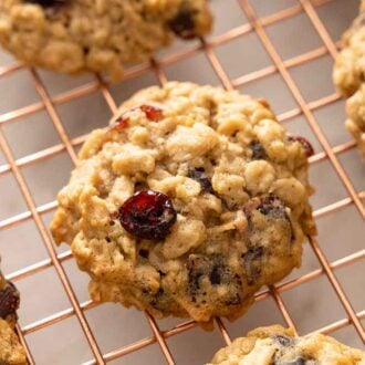 Overhead view of oatmeal cranberry cookies on a cooling rack.