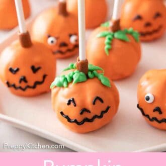 Pinterest graphic of a plate of pumpkin cake pops with faces on them.