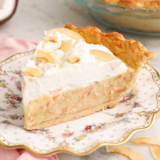 A coconut cream pie piece on a plate.