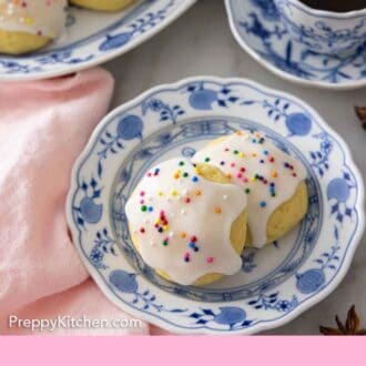 Pinterest graphic of a plate with two anise cookies in front of coffee.