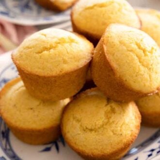 A platter of multiple cornbread muffins.