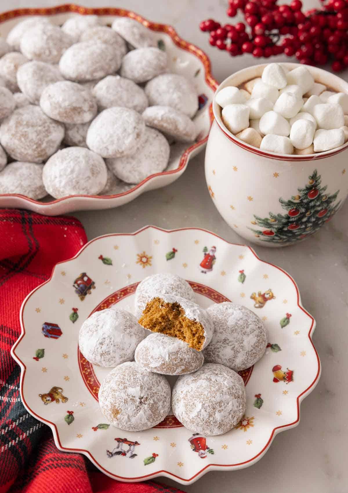 A plate with multiple Pfeffernusse with one bitten in half.