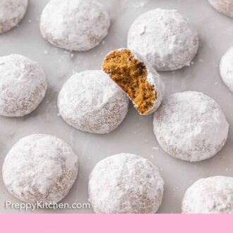 Pinterest graphic of multiple Pfeffernusse laid on a flat surface, one cut opened, propped on top.