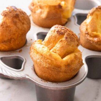Multiple popovers in its baking pan.