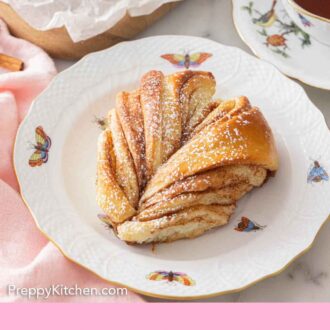 Pinterest graphic of a piece of star bread on a plate.