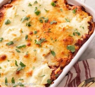 Pinterest graphic of a white baking dish containing baked ziti with fresh herb garnish on top.