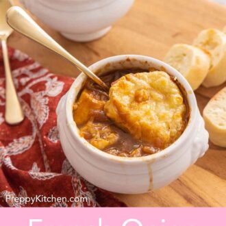 Pinterest graphic of a bowl of French onion soup with a spoon inserted.