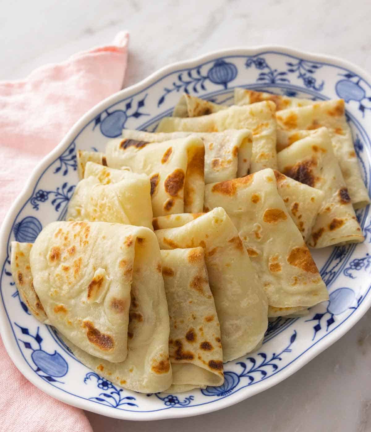 A platter of multiple folded lefse.