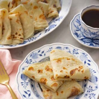 Pinterest graphic of a plate with three folded lefse by a platter with more.