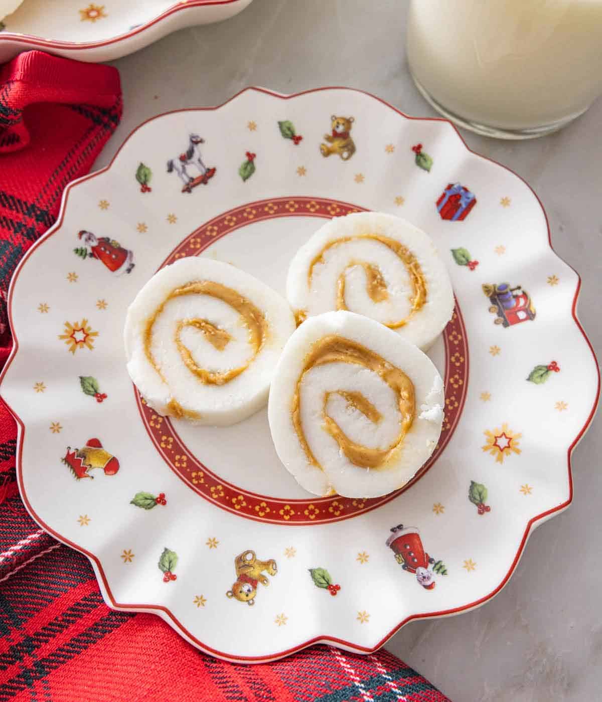 Overhead view of a plate with three potato candies.
