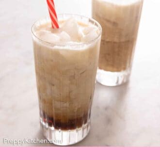 Pinterest graphic of two glasses of Colorado Bulldog cocktails with a striped straw in each.