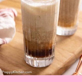 Pinterest graphic of two glasses of Colorado Bulldogs on a wooden serving board.