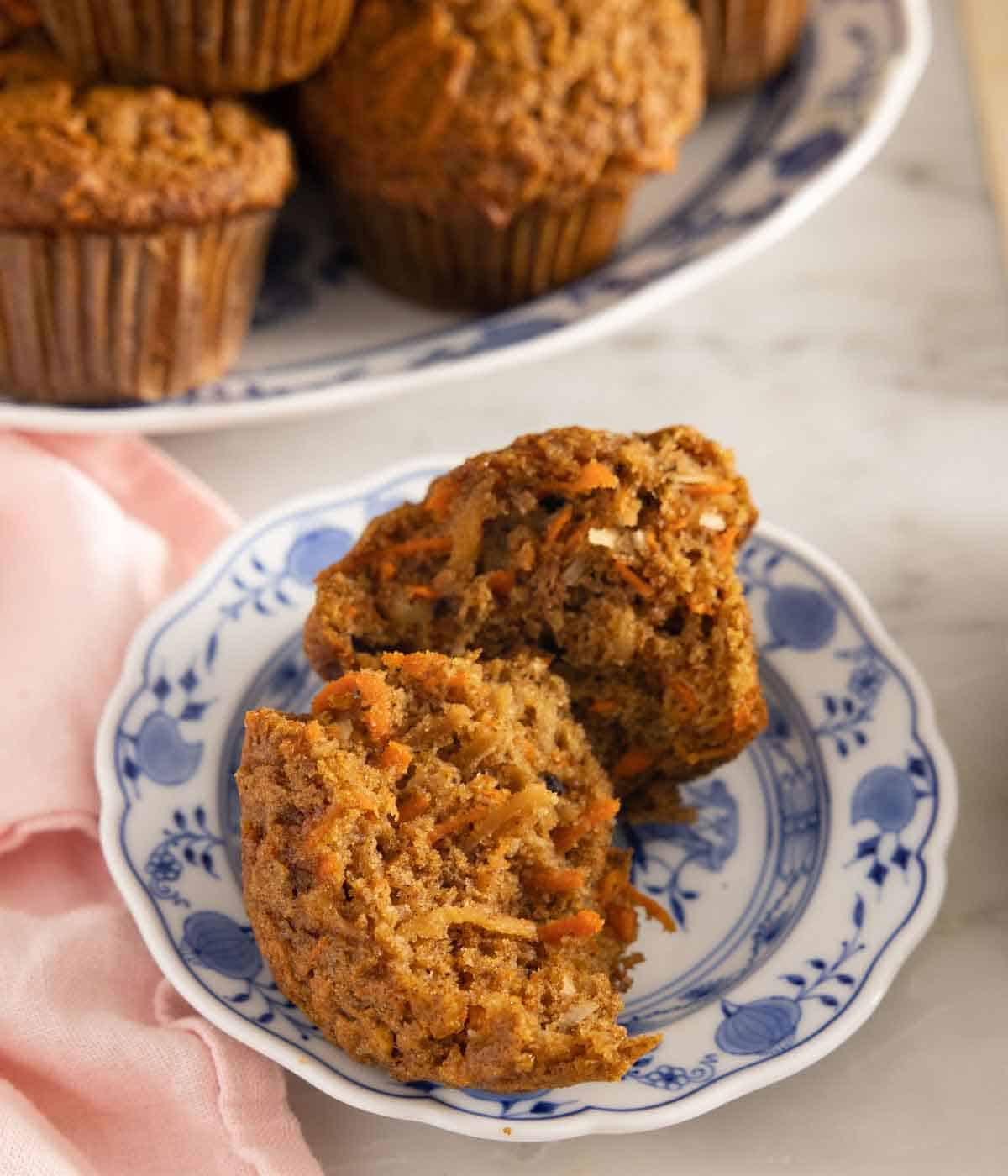 Close up of a small plate with a morning glory muffin, cut in half.