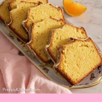 Pinterest graphic of a platter of a orange cake sliced.