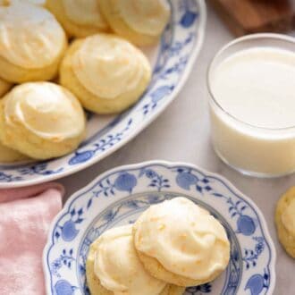 Pinterest graphic of a plate of two orange cookies beside a platter of cookies.