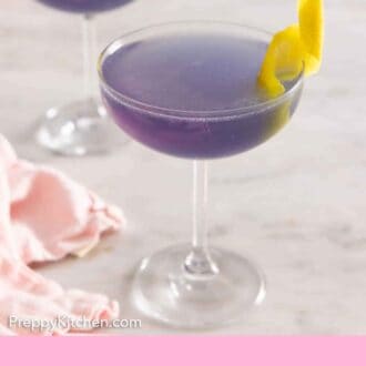 Pinterest graphic of glasses of Aviation cocktails with lemon twist garnish.